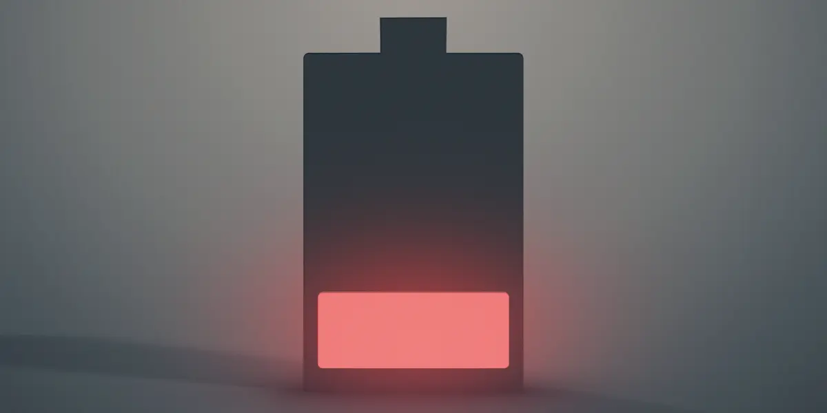 A black battery with a red indicator, possibly indicating a low charge or malfunction.
