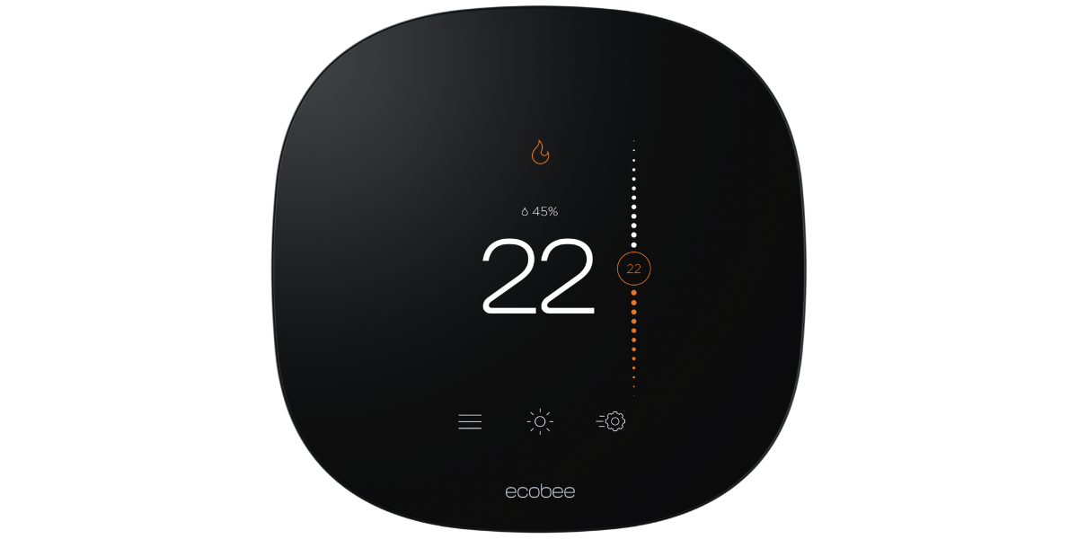 A smart thermostat with a black face and a white display. The display shows the current temperature and humidity level. The ecobee logo is visible on the thermostat.